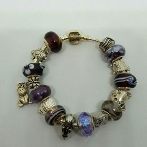 Animal theme charm bracelet with purple beads